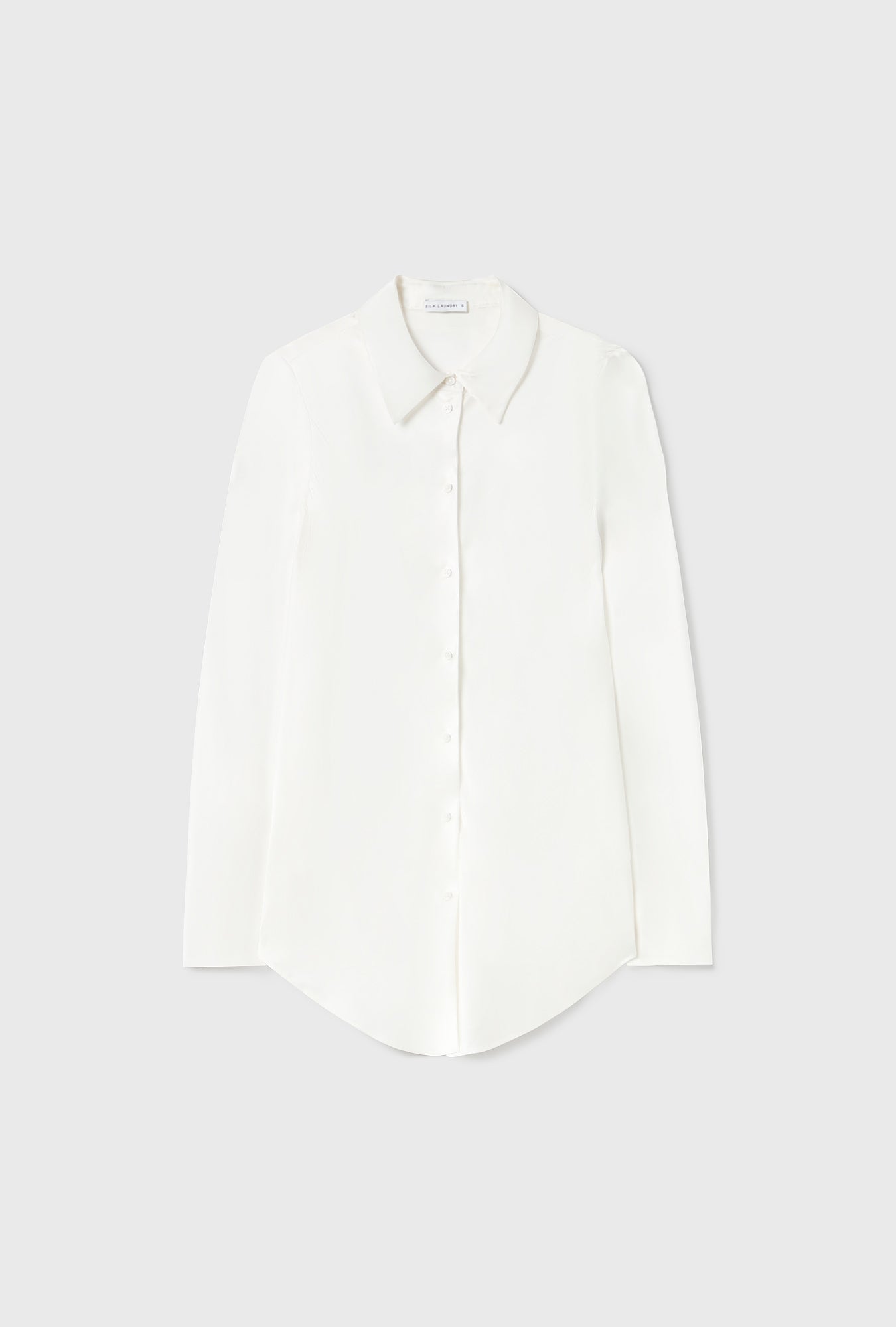 Chemise coupée en biais blanche
